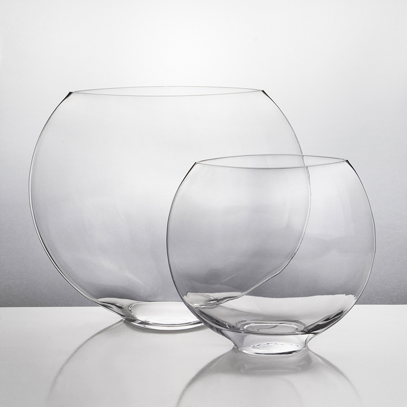 Oval shaped glass moon vases are flat and elegant. Great for saving space!